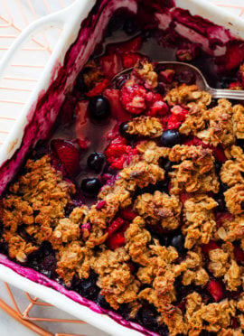 mixed berry crisp with serving spoon