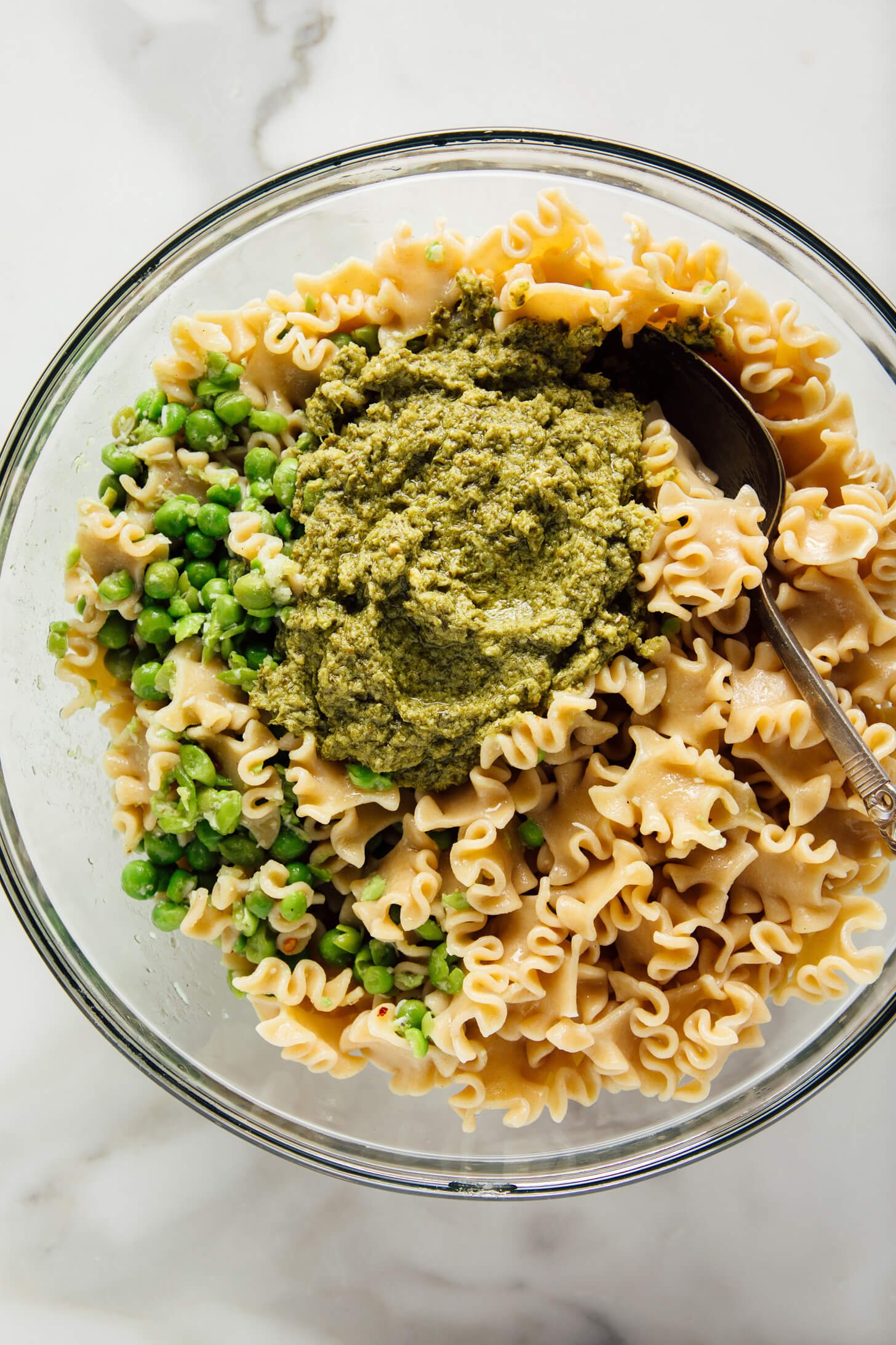 pasta with peas and pesto in bowl