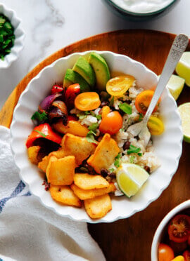 Vegetarian halloumi fajita bowl with black beans, rice, avocado and tomato